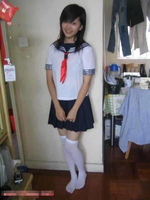 Babe in a uniform and thigh high stockings fucking