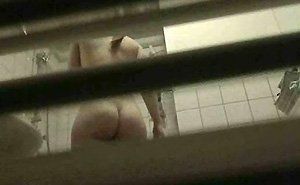 Nude woman voyeur window